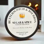 Round candle tin labeled Butterscotch & Bourbon.