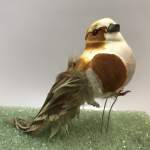 Small decorative bird figurine with brown and white feathers