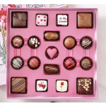 Pink box of assorted chocolates with Valentine-themed decorations