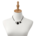 Black cord necklace with three round pendants on a display bust