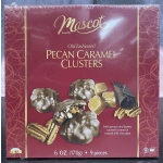 Box of pecan caramel clusters in burgundy packaging