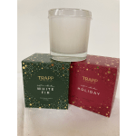 Two boxed scented candles with a glass candle jar on top