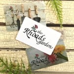 Garden tools and logo cards on a rustic wood background