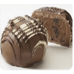 Chocolate loaf cake with chocolate drizzle and a sliced piece behind it