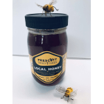 Jar of local honey with two decorative bee figurines