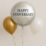 Three balloons, including one that says Happy Anniversary
