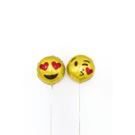 Two yellow emoji balloons with heart eyes and a kissing face