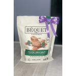 Bag of caramel candies tied with a purple ribbon