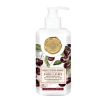 Bottle of dark cherry hand and body lotion with a pump dispenser