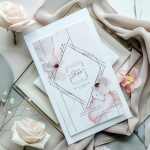 Floral-themed stationery with pale roses and pink blossoms