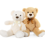 Two plush teddy bears sitting side by side, one white and one tan.