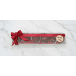 Box of chocolate truffles tied with a red ribbon and thank-you tag