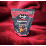 Bag of dark chocolate sea salt caramels on red fabric