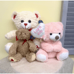 Three teddy bears, one holding a heart balloon