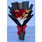 Bouquet of red roses wrapped in black paper with a red ribbon