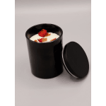 Black candle jar with white wax and dried rose petals