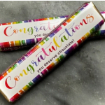 Two rainbow-wrapped chocolate bars with congratulatory text