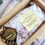 Bath soak and a strawberry-shaped soap in a gift box