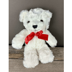 White plush teddy bear with a red ribbon bow
