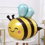 Bee-shaped foil balloon with a smiling face and blue wings