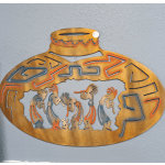Decorative metal wall art with stylized figures in an oval frame