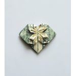 Folded dollar bill shaped like a heart with a bow
