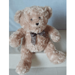 Plush teddy bear with a checkered bow tie
