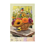 Basket of colorful daisies with decorative birds