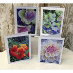 Four greeting cards with colorful flower artwork