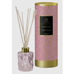 Pink reed diffuser in a faceted glass bottle with a decorative box