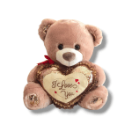Plush teddy bear holding a heart with "I Love You" text