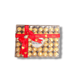 Box of Ferrero Rocher chocolates tied with a red ribbon