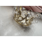 Gold-toned tiara with pearl accents in plastic wrap
