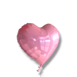 Pink heart-shaped foil balloon on a white background
