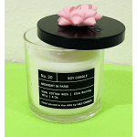 Soy candle in a clear glass jar with a black lid and pink bow