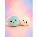 Two small plush toys with smiling faces on a pastel background.