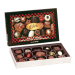 Rectangular box of assorted milk and dark chocolates with the lid propped behind it