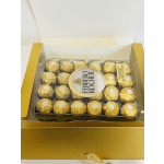 Box of Ferrero Rocher chocolates in gold wrappers
