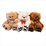 Three teddy bears with ribbon bows sitting together