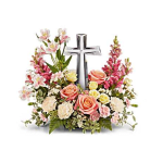 Pink and white floral arrangement with a silver cross centerpiece