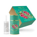 Tea gift set with a green canister, infuser, and floral box