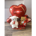Gift set with red heart balloons, chocolates, and a plush bear in a box