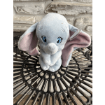 Plush blue elephant toy with pink inner ears
