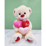 Plush teddy bear holding three heart pillows with love messages