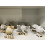 Small painted animal figurines displayed on a shelf