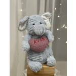 Plush blue elephant holding a pink heart with the word Kiss