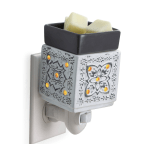Ceramic plug-in wax warmer with a small dish on top