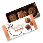 Box of assorted chocolates with a branded sleeve