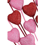 Glittery heart-shaped picks in pink and red on sticks