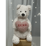 White teddy bear holding a pink heart with "xoxo" text